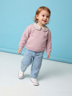 Jeans con Bordado Flores en Bolsillos