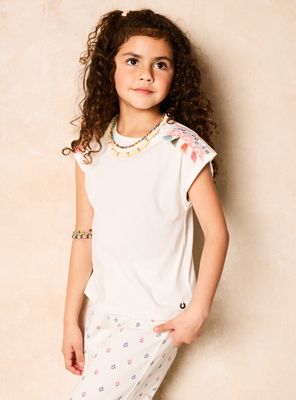 Polera Diseño con Mostacillas y Borlas